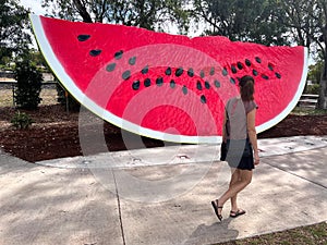 Australian woman looking at Chinchilla watermelon Queensland Australia