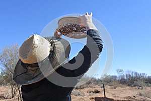 Australian woman searching gem stones in Australia outback