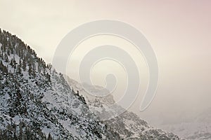 Austria, mountain view at sunset among clouds