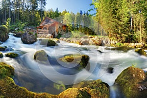 Austria panorama landscape with waterfall and watermill near Sal
