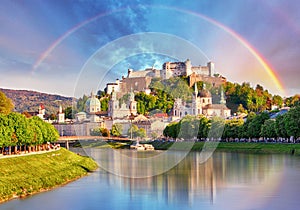 Austria, Rainbow over Salzburg castle photo