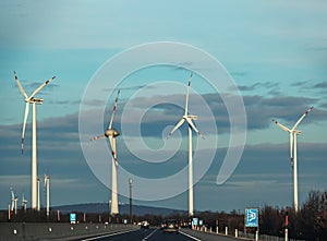 Austria, road to Vienna from Bratislava - 01.14.2024: Wind farm park next to a road in Austria in sunny weather