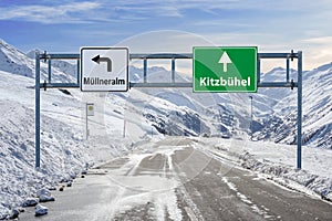 Austria ski town Mullneralm and Kitzbuhel road big sign with a lot of snow and mountain sky