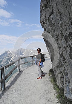 Austria, woman on mountain path