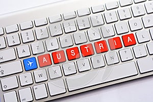 AUSTRIA writing on white keyboard with a aircraft sketch