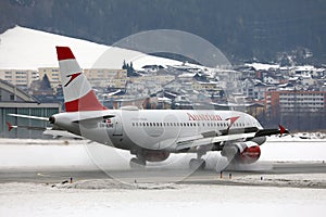 Austrian Airlines plane taxiing on Innsbruck Airport, INN