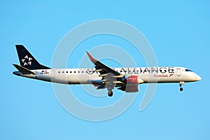 Star Alliance Austrian Airlines plane flying up in the sky