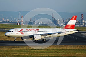 Austrian Airlines plane doing taxi on taxiway, new livery