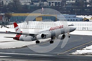 Austrian Airlines plane taking off from Innsbruck Airport