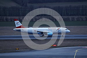 Austrian Airlines plane taxiing, night light