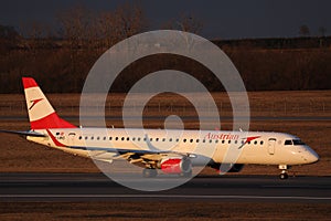 Austrian Airlines small jet taxiing on taxiway