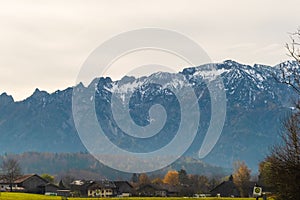 Austrian alps, Green meadows, alpine cottages and mountain peaks