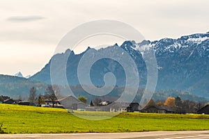 Austrian alps, Green meadows, alpine cottages and mountain peaks