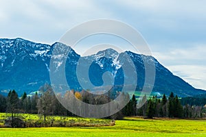 Austrian alps, Green meadows, alpine cottages and mountain peaks