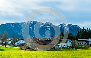 Austrian alps, Green meadows, alpine cottages and mountain peaks