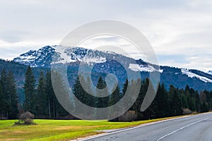 Austrian alps, Green meadows, alpine cottages and mountain peaks