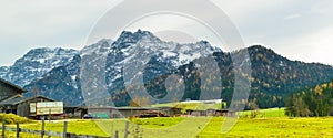 Austrian alps, Green meadows, alpine cottages and mountain peaks