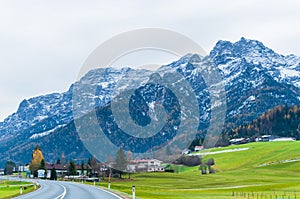 Austrian alps, Green meadows, alpine cottages and mountain peaks