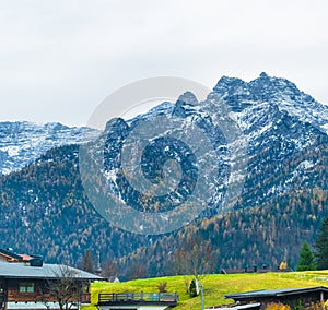 Austrian alps, Green meadows, alpine cottages and mountain peaks