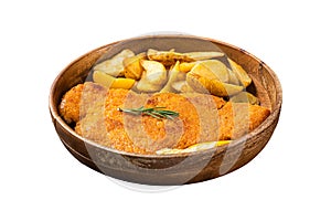 Austrian fried weiner schnitzel with potato wedges in a wooden plate. Isolated on white background. Top view.