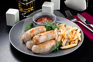 Austrian grilled sausages with french fries are a traditional snack