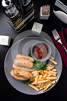 Austrian grilled sausages with french fries are a traditional snack