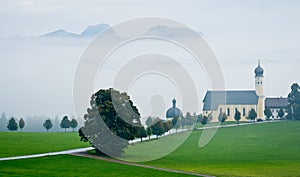 Austrian landscape with church in bad weather