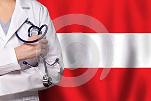 Austrian medicine and healthcare concept. Doctor close up against flag of Austria background