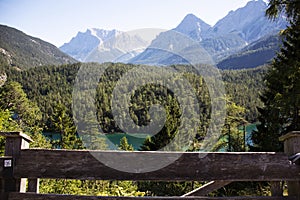 Austrian people and foreign travelers rest and dining at Rasthaus Zugspitzblick restaurant and visit viewpoint of Blindsee lake at photo