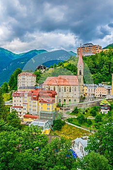 Austrian ski and spa resort Bad Gastein dominated by a parish church and a waterwall flowing through ist city center