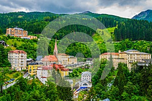 Austrian ski and spa resort Bad Gastein dominated by a parish church and a waterwall flowing through ist city center