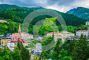 Austrian ski and spa resort Bad Gastein dominated by a parish church and a waterwall flowing through ist city center