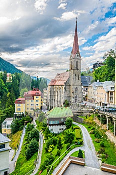 Austrian ski and spa resort Bad Gastein dominated by a parish church and for waterwall flowing through ist city center