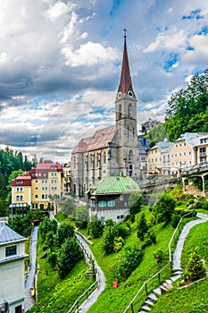 Austrian ski and spa resort Bad Gastein dominated by a parish church and for waterwall flowing through ist city center