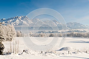 Austrian Winter Wonderland with mountains, fresh snow and haze