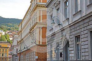 Austro-Hungarian architecture, located along Gimnazijska street, with colorful buildings and carvings