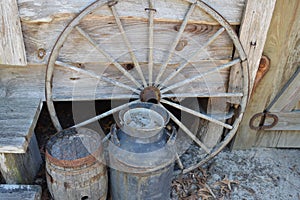 Antique Wagon Wheel and Water Barrels