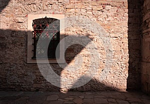 Authentic architecture. window in a stone building photo