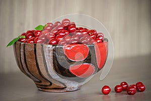 Authentic ceramic bowl with cherry.
