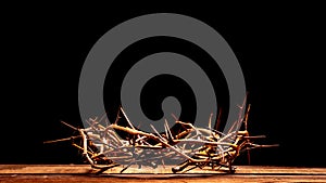 A crown of thorns on a wooden background. Easter Theme