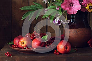 Authentic dark still life with nectarines.