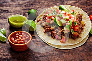 Authentic food in form of tacos mexican with canned beans and meat