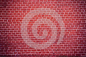 An authentic fragment of the red brick wall of the Moscow Kremlin in Russia. Brick red background for design.