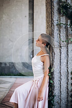 Authentic girl dancing on the street barefoot