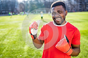 authentic happy football trainer working out outdoor in summer great day