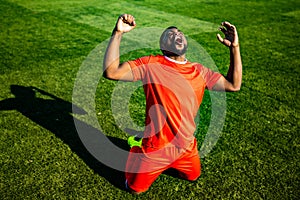 authentic happy football trainer working out outdoor in summer great day