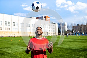 authentic happy football trainer working out outdoor in summer great day