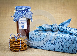 Authentic homemade jam and cookies with fabric wrapped gift. Make, bake, recycle and reuse for sustainable giving