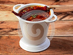 Authentic Indian popular food Dal Tadka Curry or Traditional Indian soup lentils on rustic wooden background. selective focus