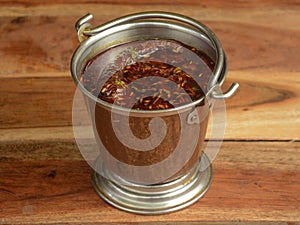 Authentic Indian popular food Dal Tadka Curry or Traditional Indian soup lentils on rustic wooden background. selective focus